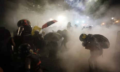 Federal officers launch teargas at a group of demonstrators during a Black Lives Matter protest in Portland, Oregon, in July 2020.