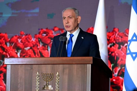 Benjamin Netanyahu speaking on stage.