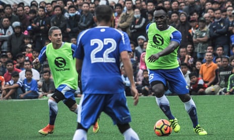 Michale Essien is watched by thousands of fans during practice for Persib Bandung, where he is reportedly paid around £10,000 a week.