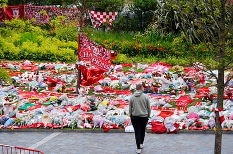 Flags, scarves, flowers and Liverpool shirts have been laid in tribute to Diogo Jota