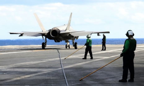 An F-35C stealth jet on deck of the USS Carl Vinson in the western Pacific, south of Japan