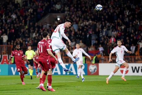 Wales' Kieffer Moore heads towards goal during the Euro 2024 qualifier against Armenia.
