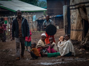 A displaced Gedeo family, outside temporary shelters in Gedeb town