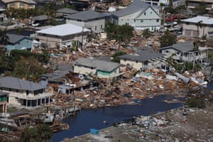 Damaged buildings litter Fort Myers beach after Hurricane Ian passed through the area