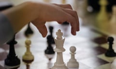 A child makes a move during a game at the Corsica Chess Club in Bastia.