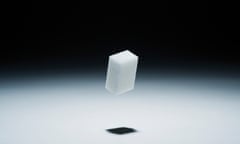A cube of sugar in mid-air<br>GettyImages-515042243