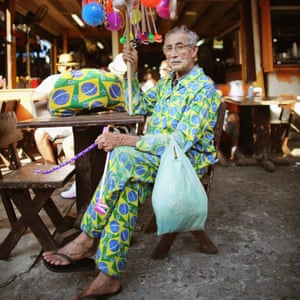 A man wearing a suit made from the Brazilian flag at the Feira de São Cristóvão.