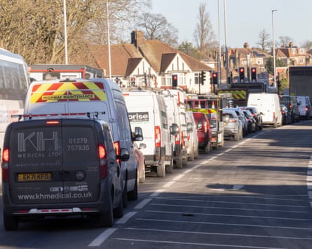 A traffic jam passing through a residential area.