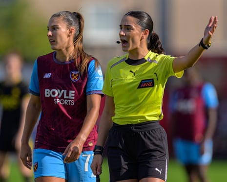 Referee Sophie Dennington officiates at a Women's Super League match
