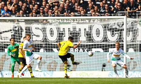 Borussia Dortmund’s Jadon Sancho scores their first goal.