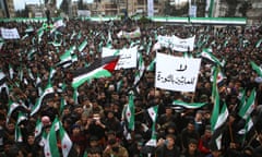 Syrians in Idlib on 15 March at a gathering to mark 13 years since pro-democracy protests swept the country