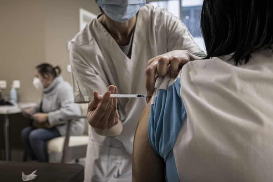 A nurse administers a Pfizer/Biontech Covid-19 vaccine in Belgium.