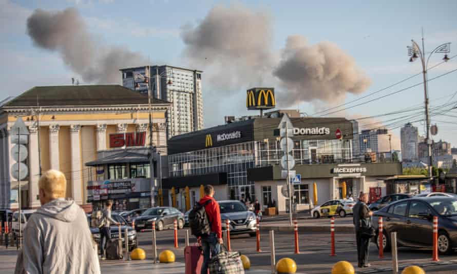 Smoke rises after a Russian missile strike in Shevchenkivskyi on Sunday