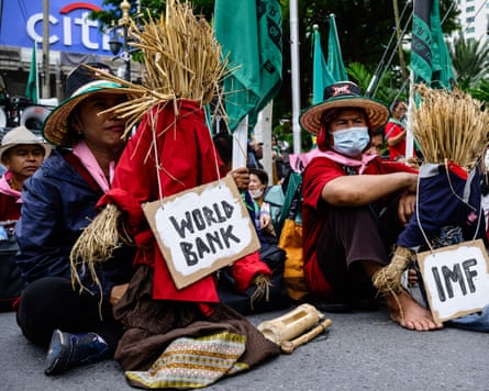 Protesters in Bangkok hold straw effigies labelled
