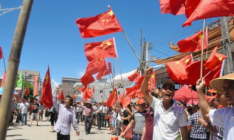 Villagers stage a protest in Wukan, Guangdong Province, China in June 2016. Police stormed homes in the village on Tuesday but were met with fierce resistance .