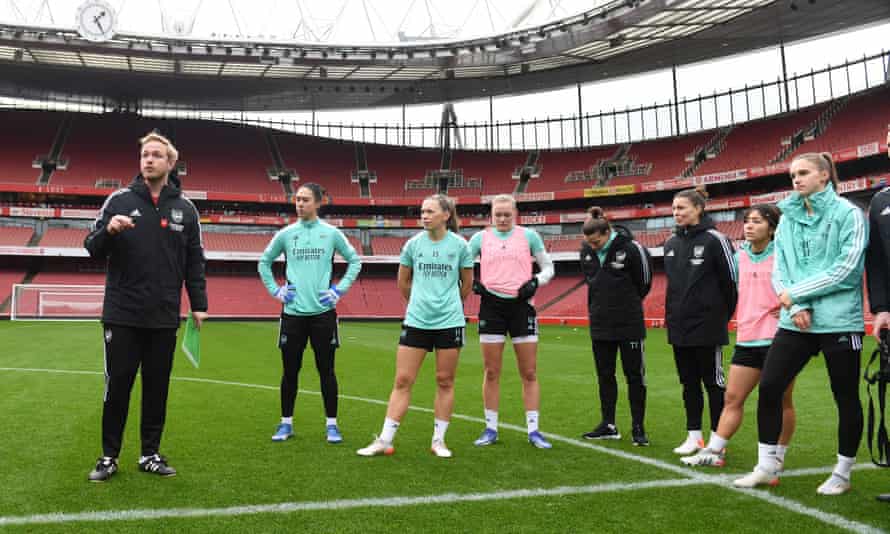Jonas Eidevall talks to his squad during training