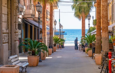 The palm-fringed streets of Alassio’s old town, leading down to the sea.