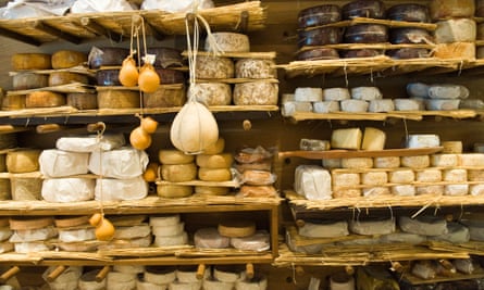 Shelves full of cheeses at La Fromagerie, Marylebone, London W1.