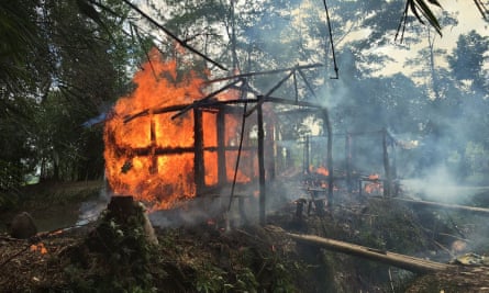 A Rohingya house on fire in Rakhine in 2017