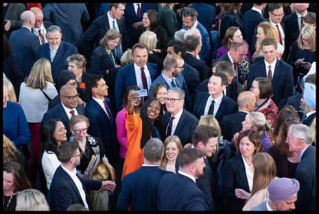 Prime minister Keir Starmer poses for a selfie with Dawn Butler MP during a photocall with Labour party MPs, after their historic landslide victory in the 2024 general election.