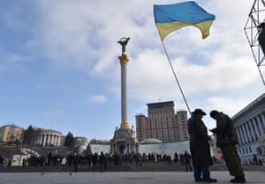 Activists wave a Ukrainian flag on Independence Square in Kiev in February.