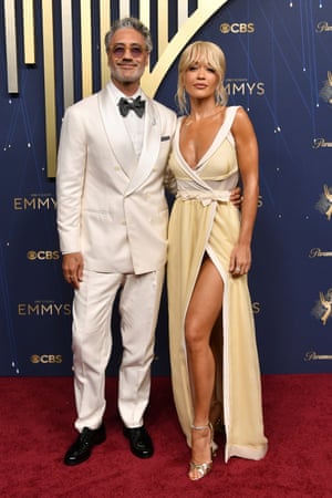 Couple Taika Waititi and Rita Ora are ready to open an ice cream stand together in shades of coconut, cream and vanilla. Ora is wearing Miu Miu