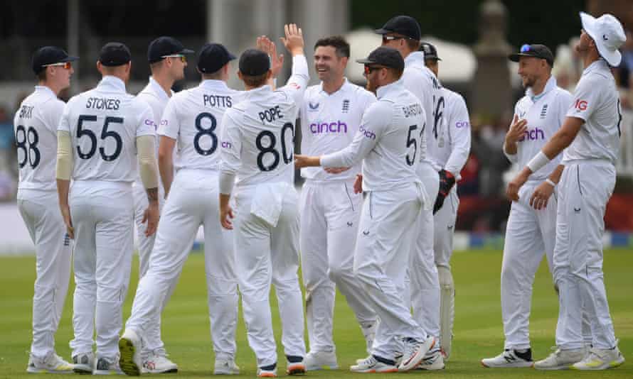 Jimmy Anderson is congratulated by his England teammates after dismissing Kyle Jamieson of New Zealand.