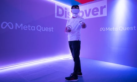 An attendee wearing a Meta Quest 2 VR headset playing a video game at the 2022 Tokyo Game Show.