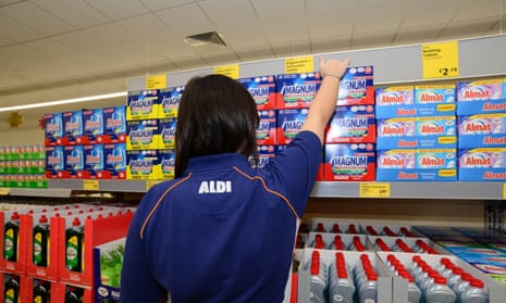 A store assistant stocking shelves in Aldi supermarket