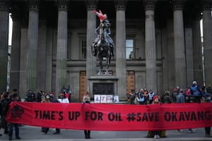 Protesters demonstrate in front of the Duke of Wellington statue in Royal Exchange Square in Glasgow