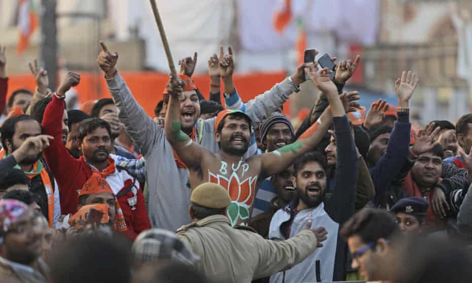 Bharatiya Janata Party’s supporters shout slogans during a campaign rally ahead of Delhi state elections 