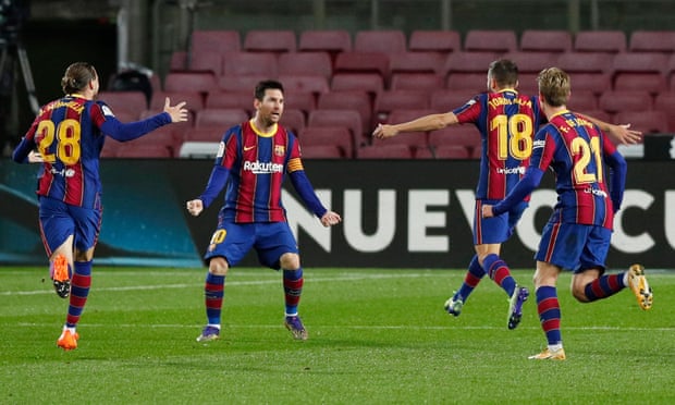Jordi Alba runs to celebrate with Lionel Messi after scoring Barcelona’s equaliser against Real Sociedad.