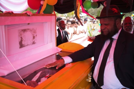 Beside the casket, former Papua New Guinea prime minister Paias Wingti grieves for his friend Joe Leahy