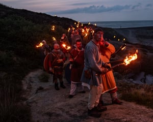 Anglesey, Wales ‘As part of Amlwch Viking festival, about 200 re-enactors paraded down the hill with fire lanterns, calling out to Odin as 1,000 spectators cheered them on from the other side of the harbour.’