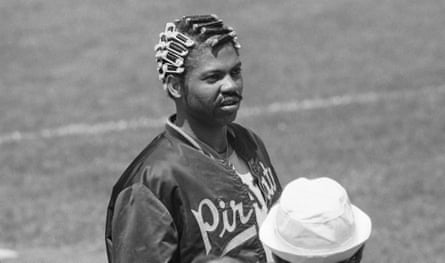 Dock Ellis famously wore hair curlers under his cap during pregame warmups in the early 1970s as an act of swagger and defiance, symbolizing his embrace of Black style and individuality within baseball’s rigid, conservative culture.