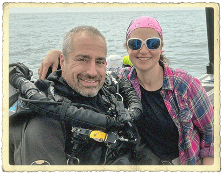 two divers on a boat