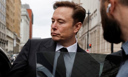 Elon Musk enters a car 