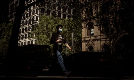 A man walks along Collins Street in Melbourne during lockdown.
