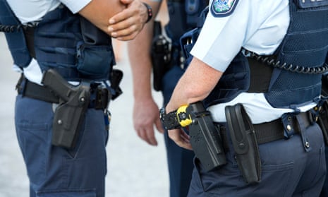 Stock photograph of Queensland Police Officers wearing hand guns and tasers in the Brisbane CBD