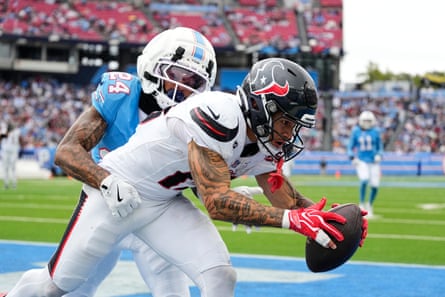 Texans wide receiver Jaylin Noel catches a touchdown pass in front of Titans cornerback Alontae Taylor during the second half of SundayâÂÂs game in Nashville.