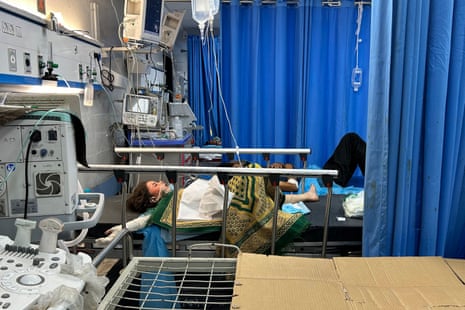 Patients receive treatment at Al-Shifa hospital in Gaza City on November 10, 2023, amid ongoing battles between Israel and the Palestinian Hamas movement.