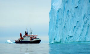 RV Polarstern in front of a mighty iceberg in inner Pine Island Bay, West Antarctica.