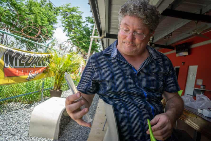 Ben Bostick tests water collected in the northern town of Arecibo.