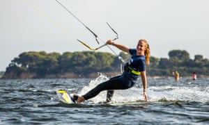 Woman kitesurfing in Sicily
