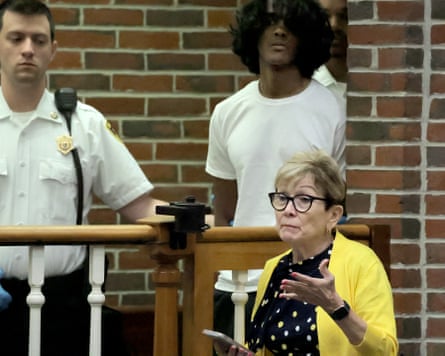 Arjun Aravind listens as his lawyer Debra DeWitt speaks.