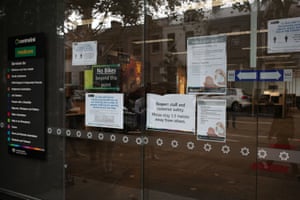 Signs are seen outside a Centrelink office in Sydney.
