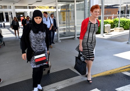 One Nation leader Pauline Hanson (right) crosses paths with Layla from Logan at Brisbane Airport on Tuesday morning
