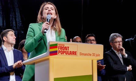 Marine Tondelier holds a microphone as she speaks on stage at a rally on Sunday