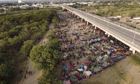 Migrants, many from Haiti, are seen at an encampment along the Del Rio international bridge near the Rio Grande, on Tuesday.