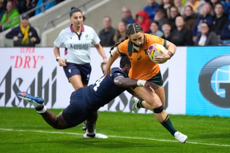 Miller breaks past Emba to score a try.